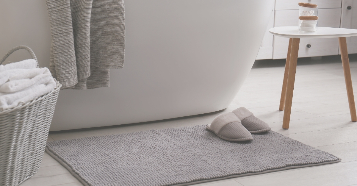 bath rug outside of a tub