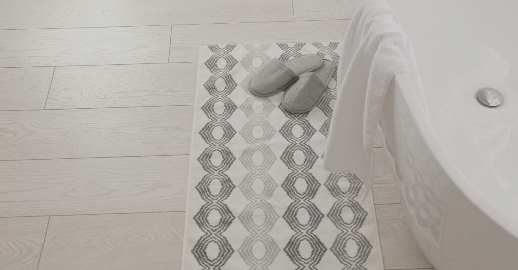 non slip rug outside of a tub